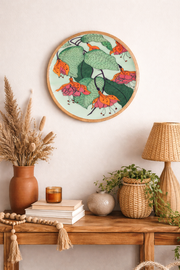 Floral round wall dEcor with illustrated leaves and hanging flowers.