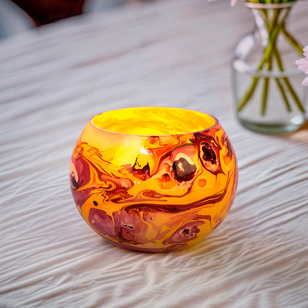 Swirling Sunset: Round Glass Tea Light Holder with Red & Yellow Marble Effect