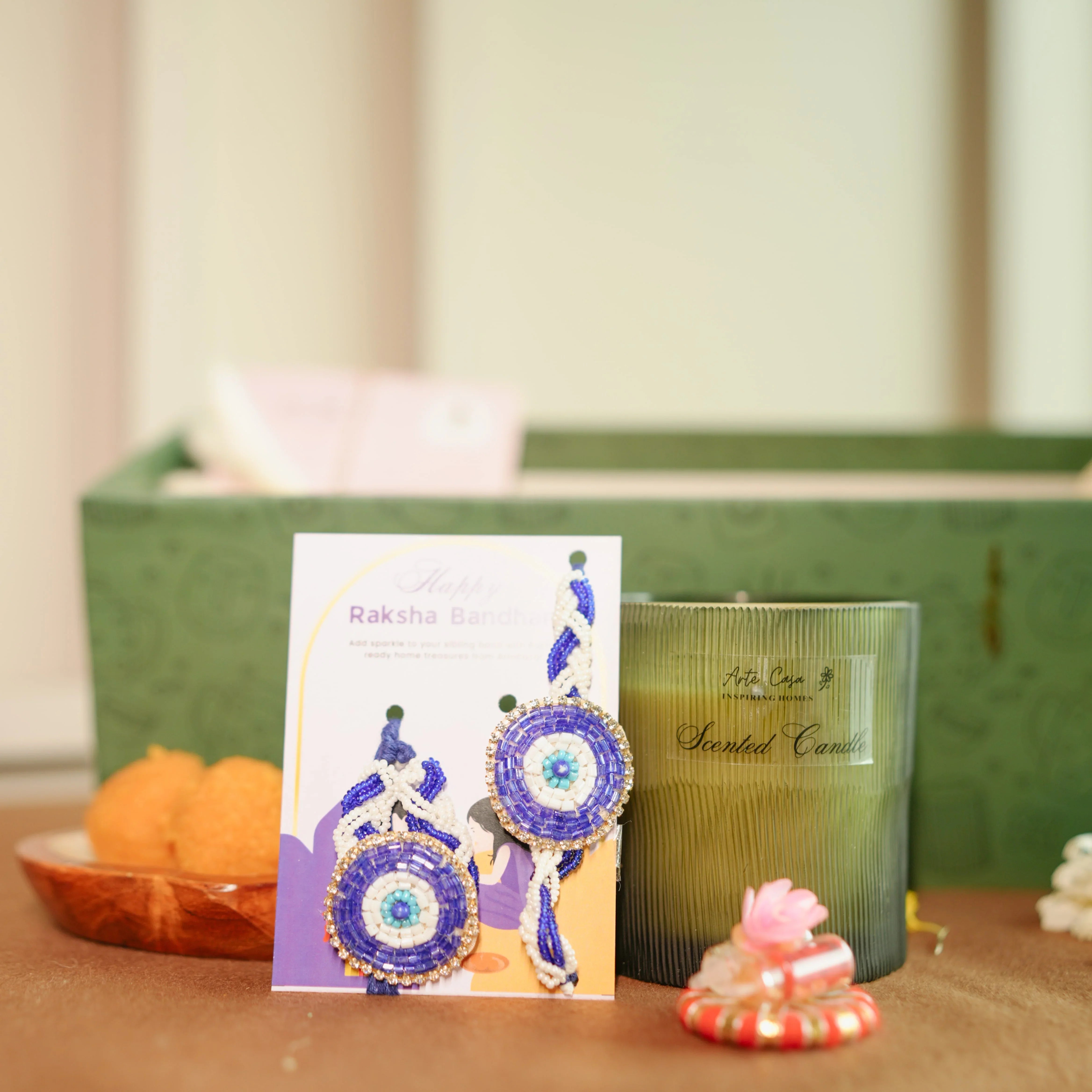 Premium Rakhi Hamper for Bhai & Bhabhi – Evil Eye Rakhi Set, Bhai Mug & Lemongrass Candle