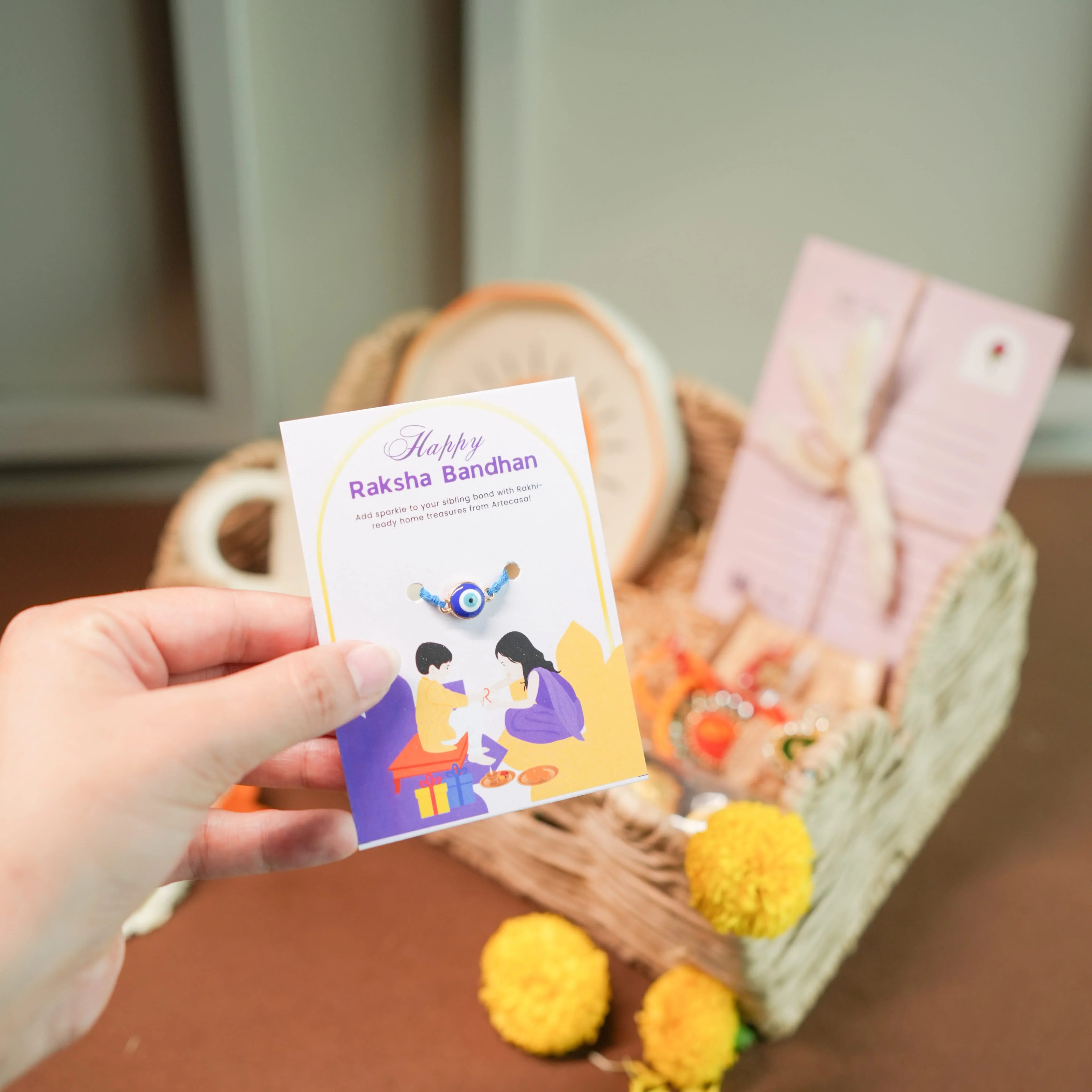 Minimal Evil Eye Rakhi Hamper for Sister | Designer Cup & Saucer Set, Roli Chawal & Fancy Basket