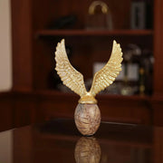 Golden Flying Egg Sculpture