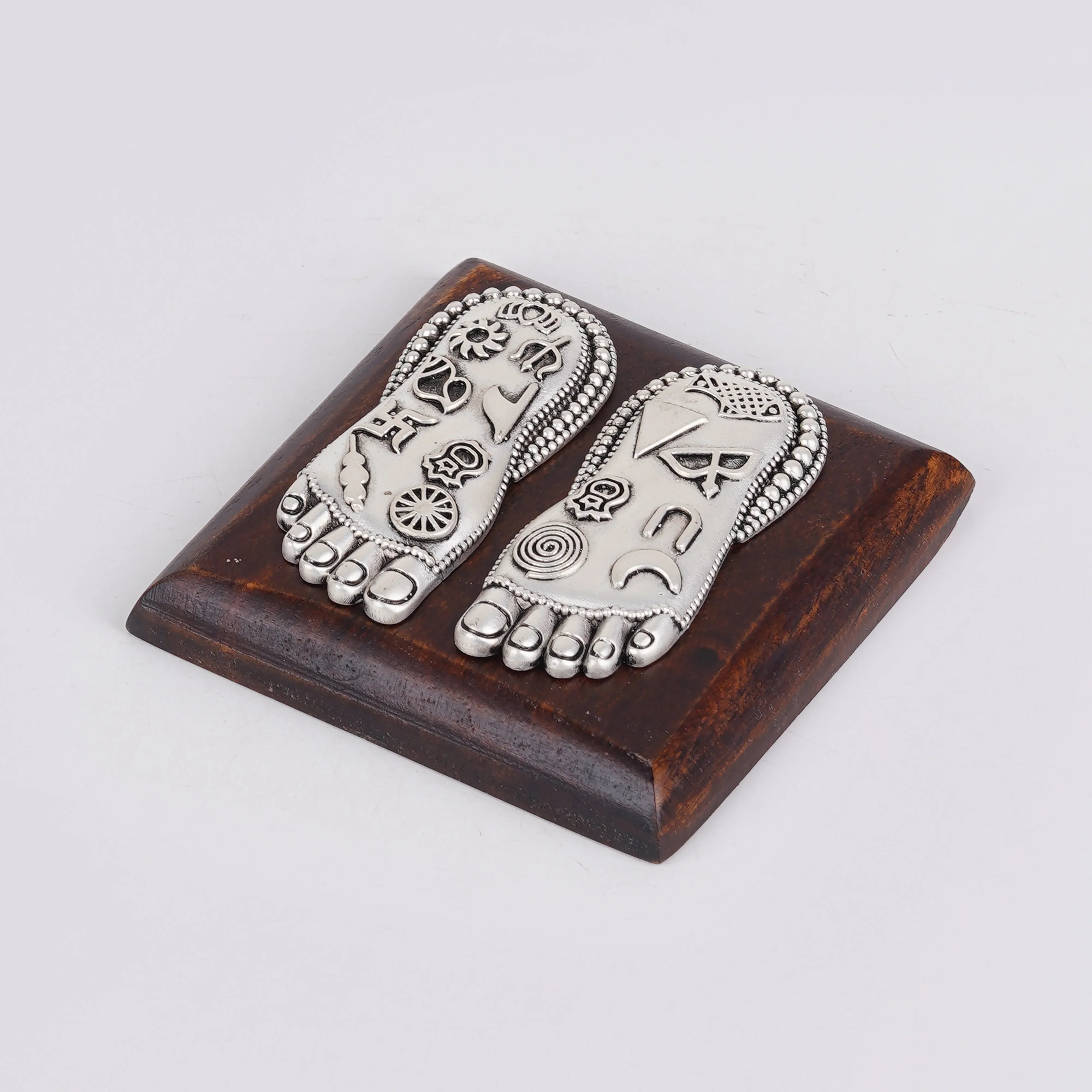 Silver Plated Brass Lakshmi Charan | Sacred Goddess Feet With Ashtamangala Symbols On Wooden Plank