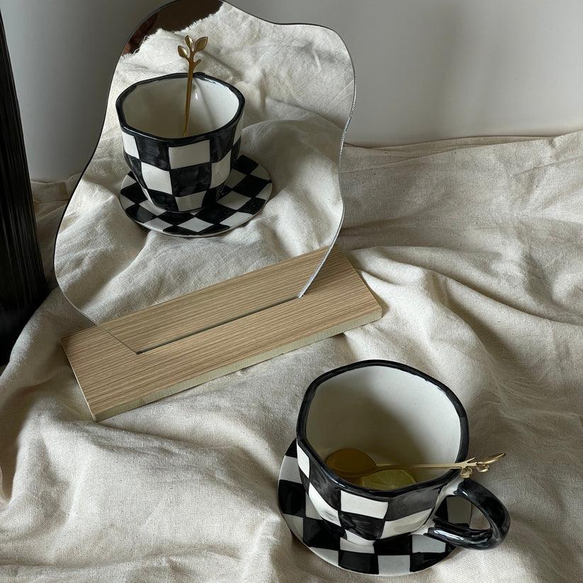 The Black Checkered Cup & Saucer | Black & White