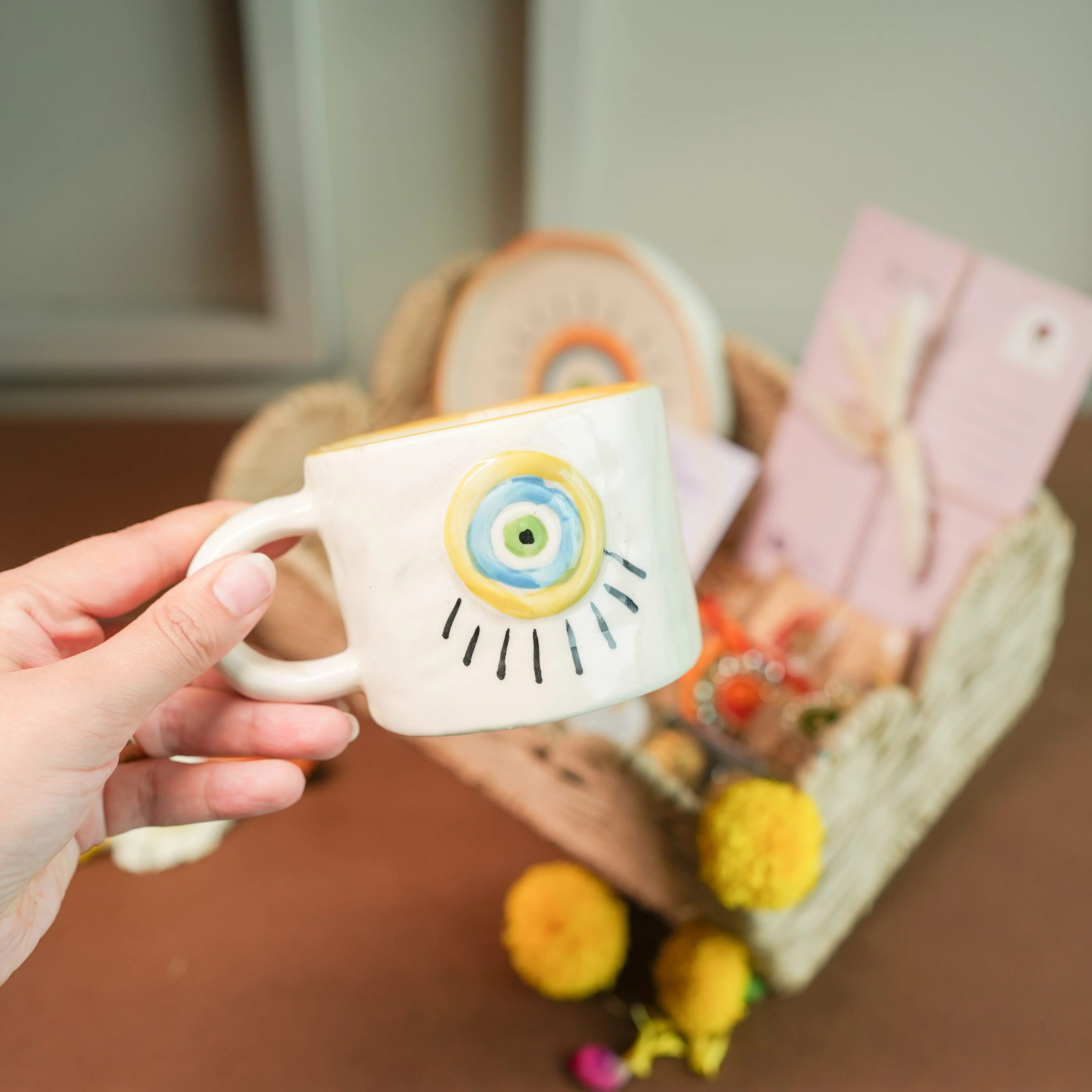 Minimal Evil Eye Rakhi Hamper for Sister | Designer Cup & Saucer Set, Roli Chawal & Fancy Basket