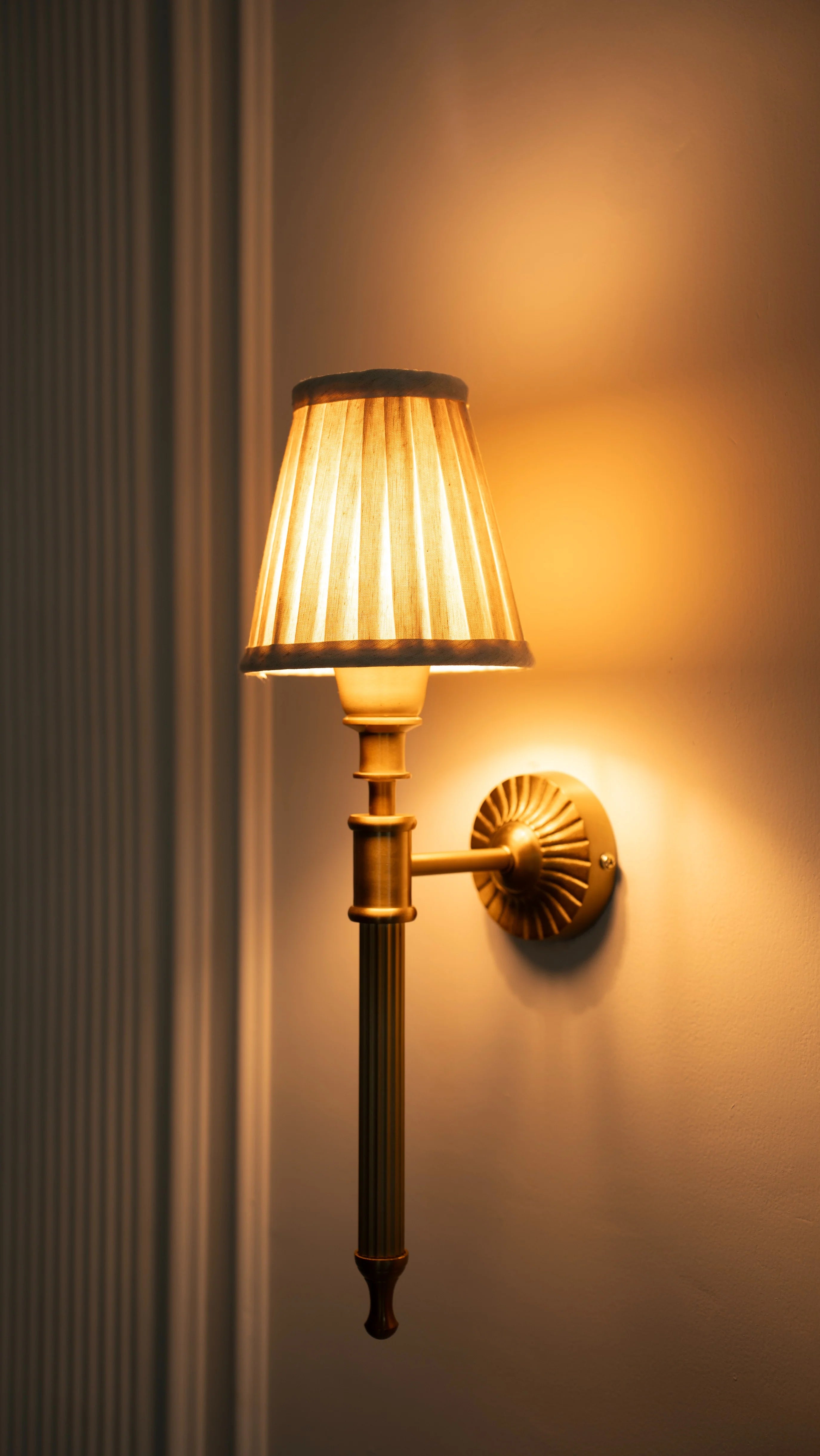 Brass Antique Finish Corrugated Wall Lamp with Off White Pleated Shade