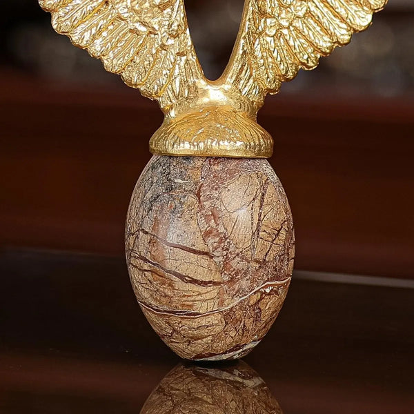 Golden Flying Egg Sculpture