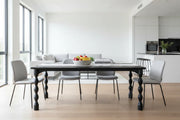 Delbee mango wood dining table in open-plan dining area with natural light