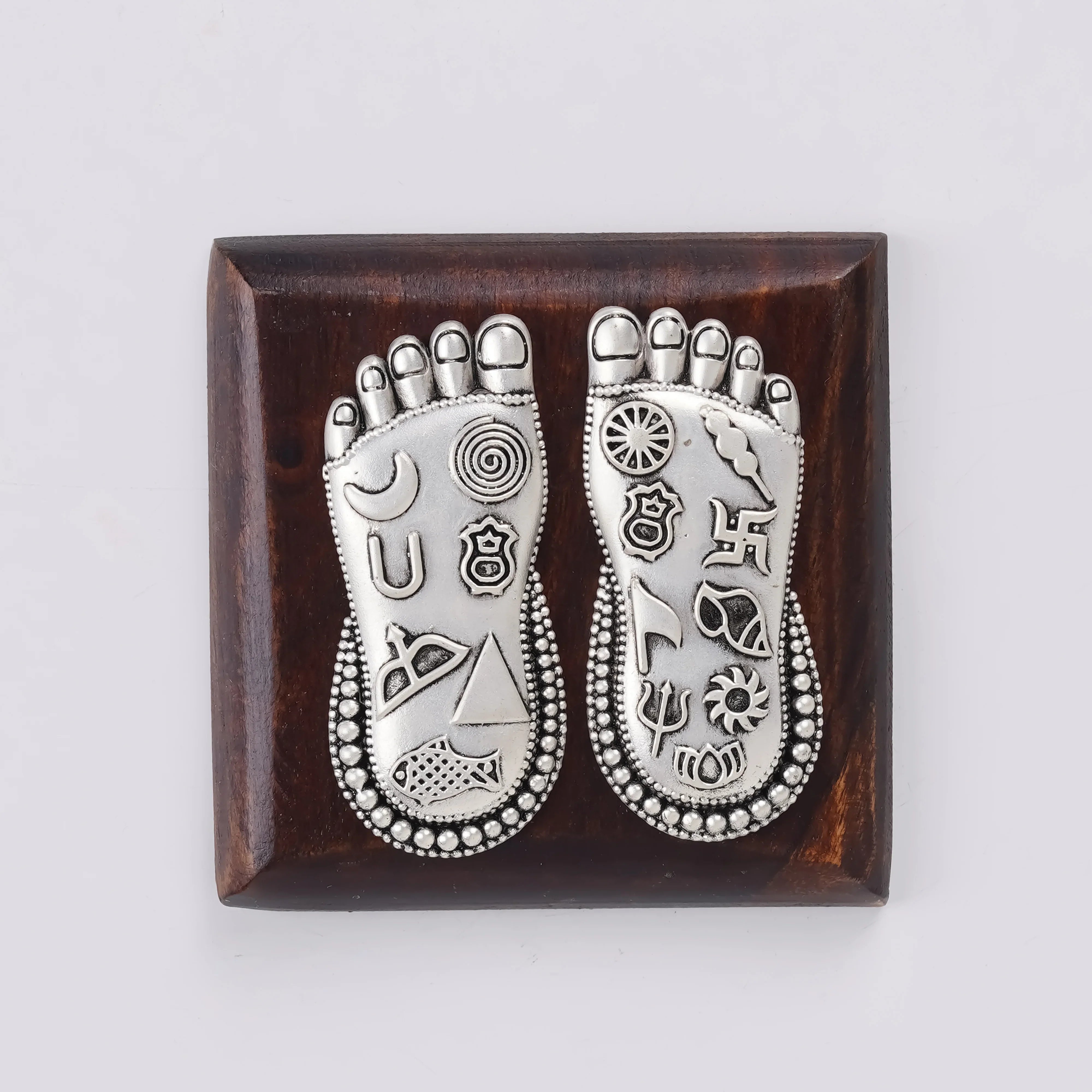 Silver Plated Brass Lakshmi Charan | Sacred Goddess Feet With Ashtamangala Symbols On Wooden Plank