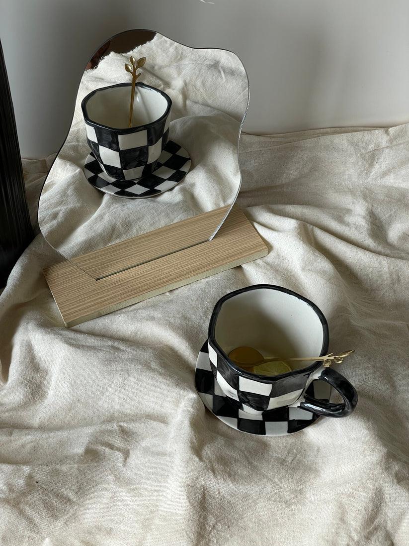 The Black Checkered Cup & Saucer | Black & White