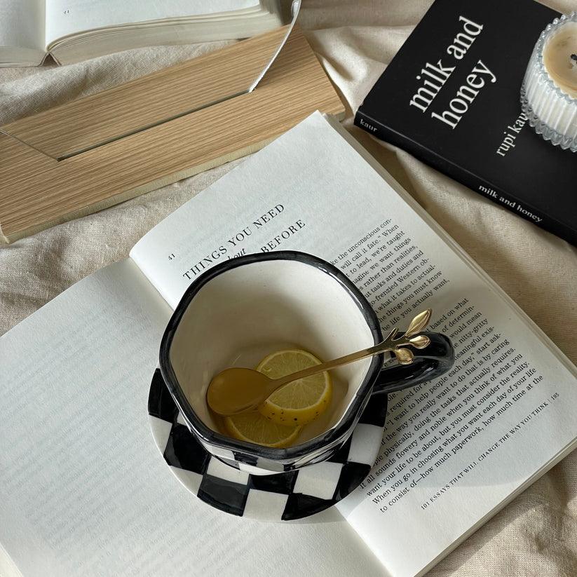 The Black Checkered Cup & Saucer | Black & White