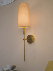 Savoy Long Arm Antique Gold Wall Sconce with Beige Fabric Shade.