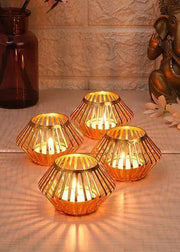 Buy Candle Stand - Gold Plated Unique Tealight Holder Set Of 4 | Metal Candle Stand by Amaya Decors on IKIRU online store