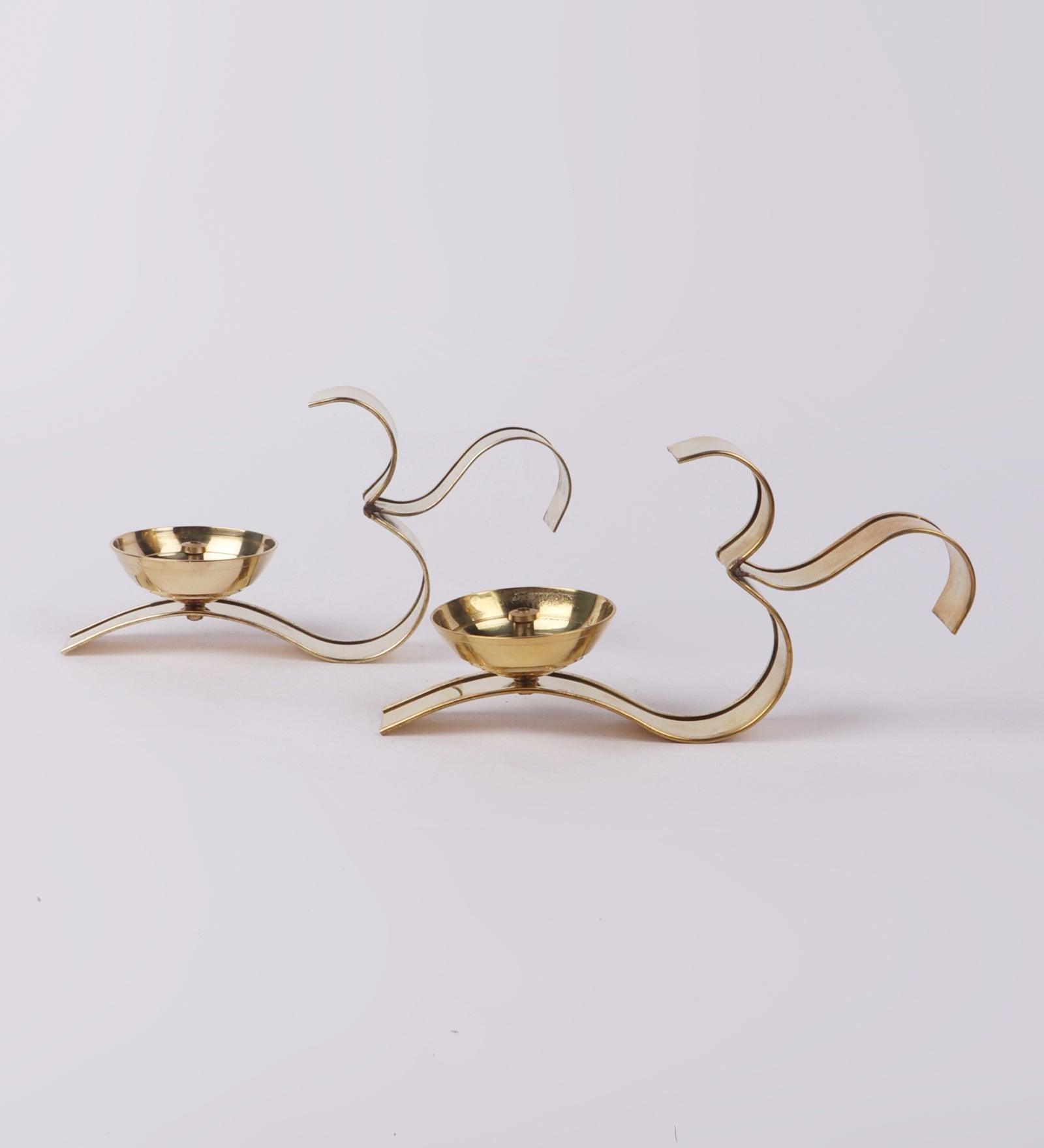 Buy Diya & Diya Stand - Om Golden Akhand Diya Set Of 2 | Brass Tealight Holder Stand by Amaya Decors on IKIRU online store